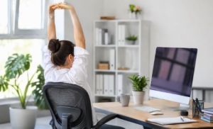 Office workers practicing healthy workplace wellness habits by Morningsun
